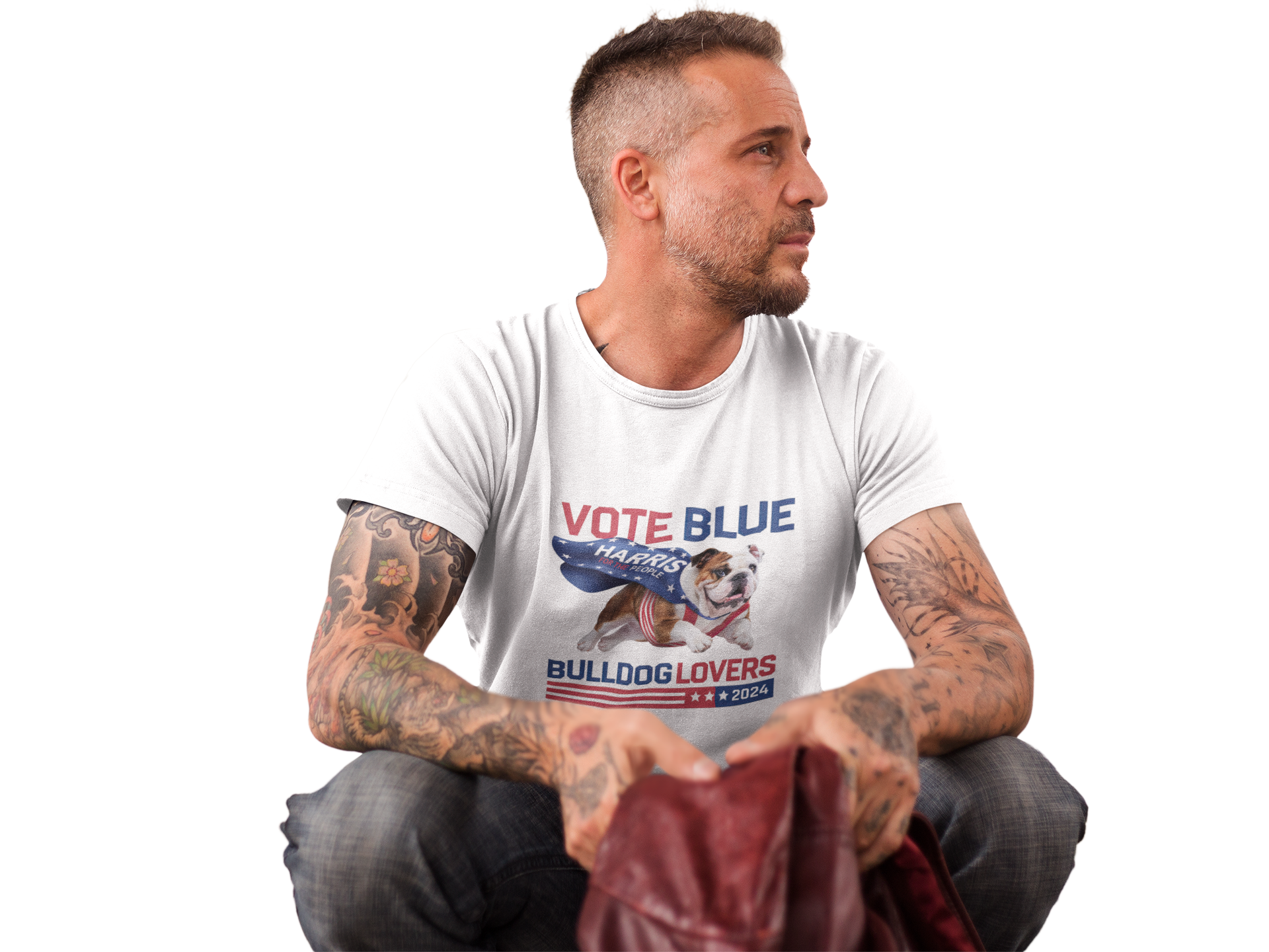 a man with tattoos sitting on the ground